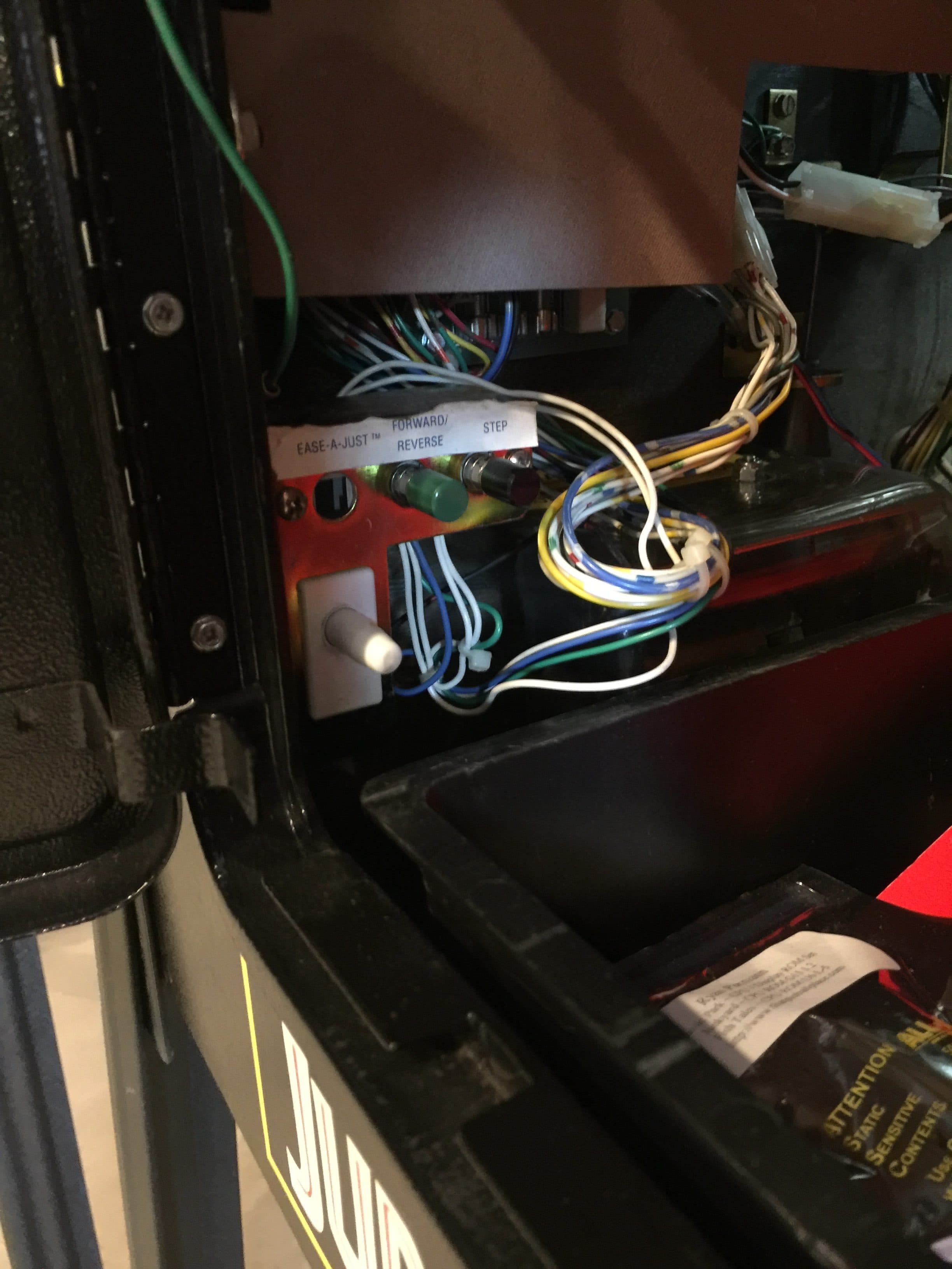 Electrical wiring and controls inside machinery with colorful wires