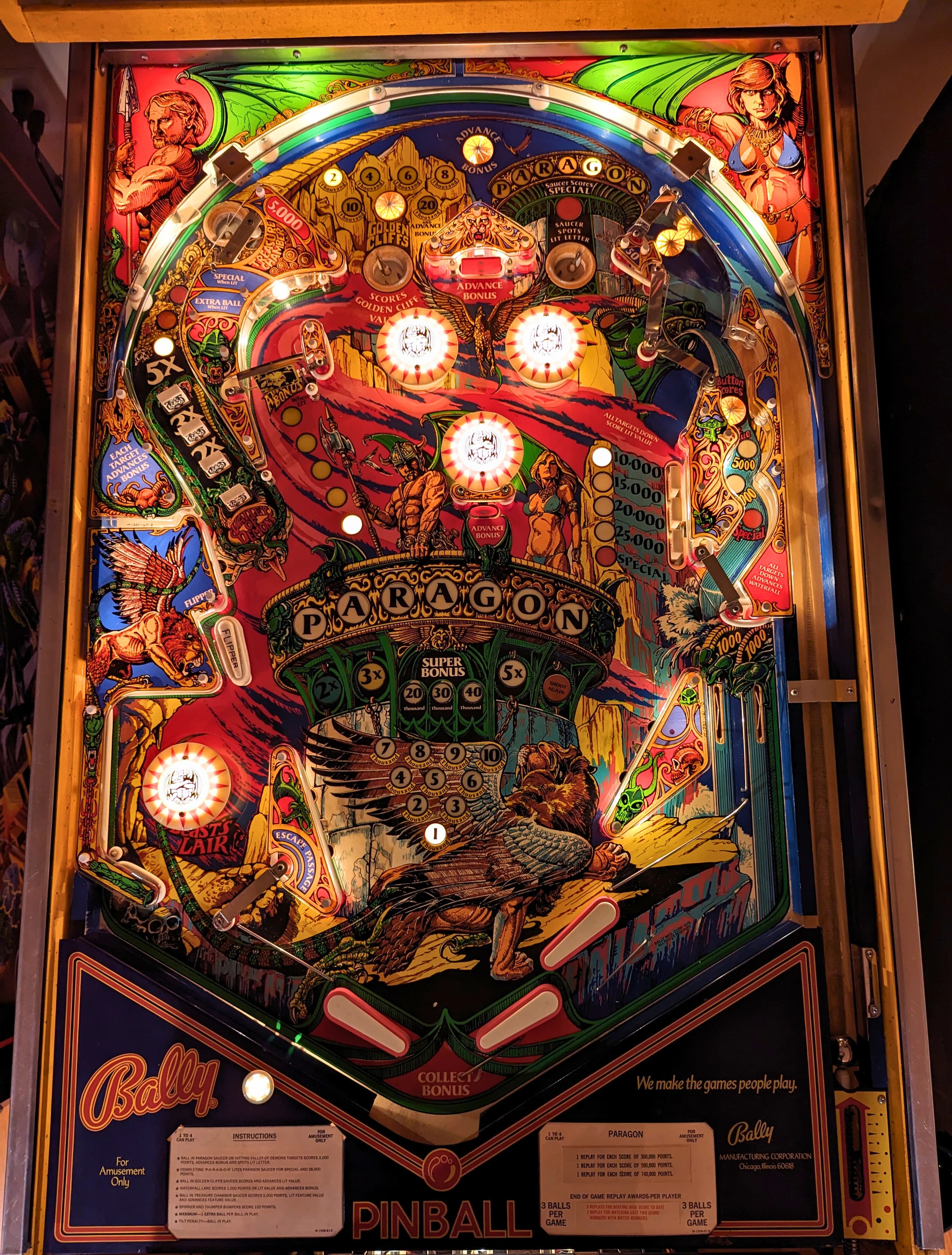 Colorful vintage Paragon pinball machine with intricate fantasy-themed artwork