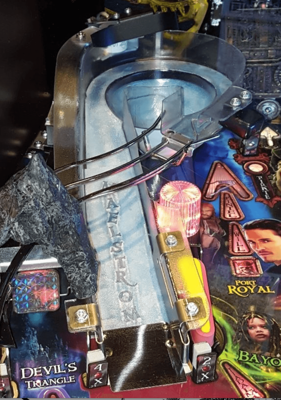 Pinball machine with Pirates of the Caribbean theme and colorful artwork