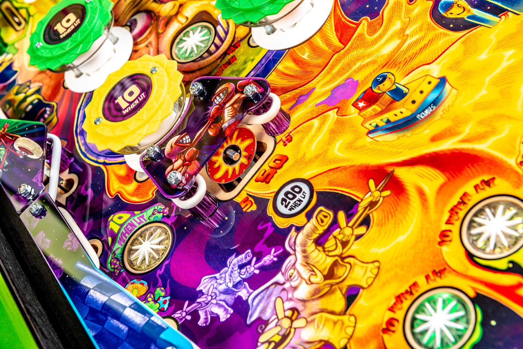 Colorful pinball machine with vibrant yellow, purple, and green details