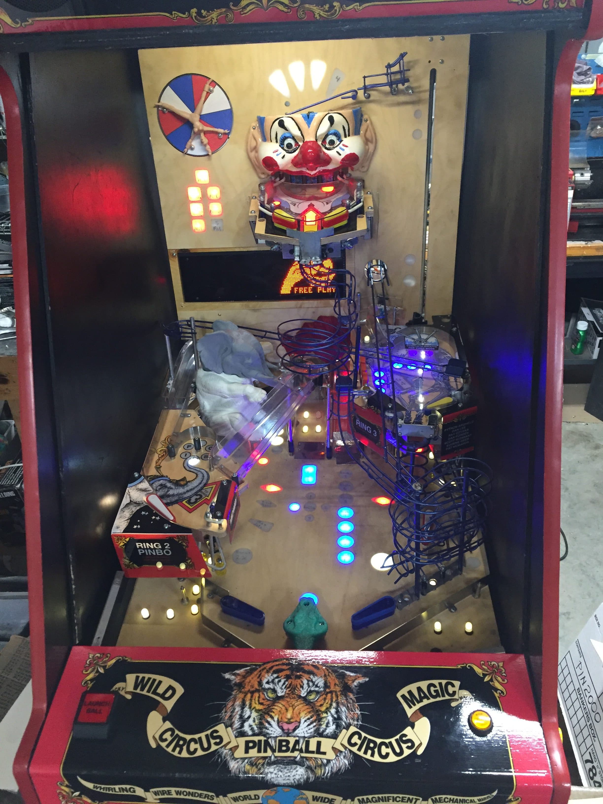 Wild Circus Magic Pinball machine with creepy clown head and colorful lights