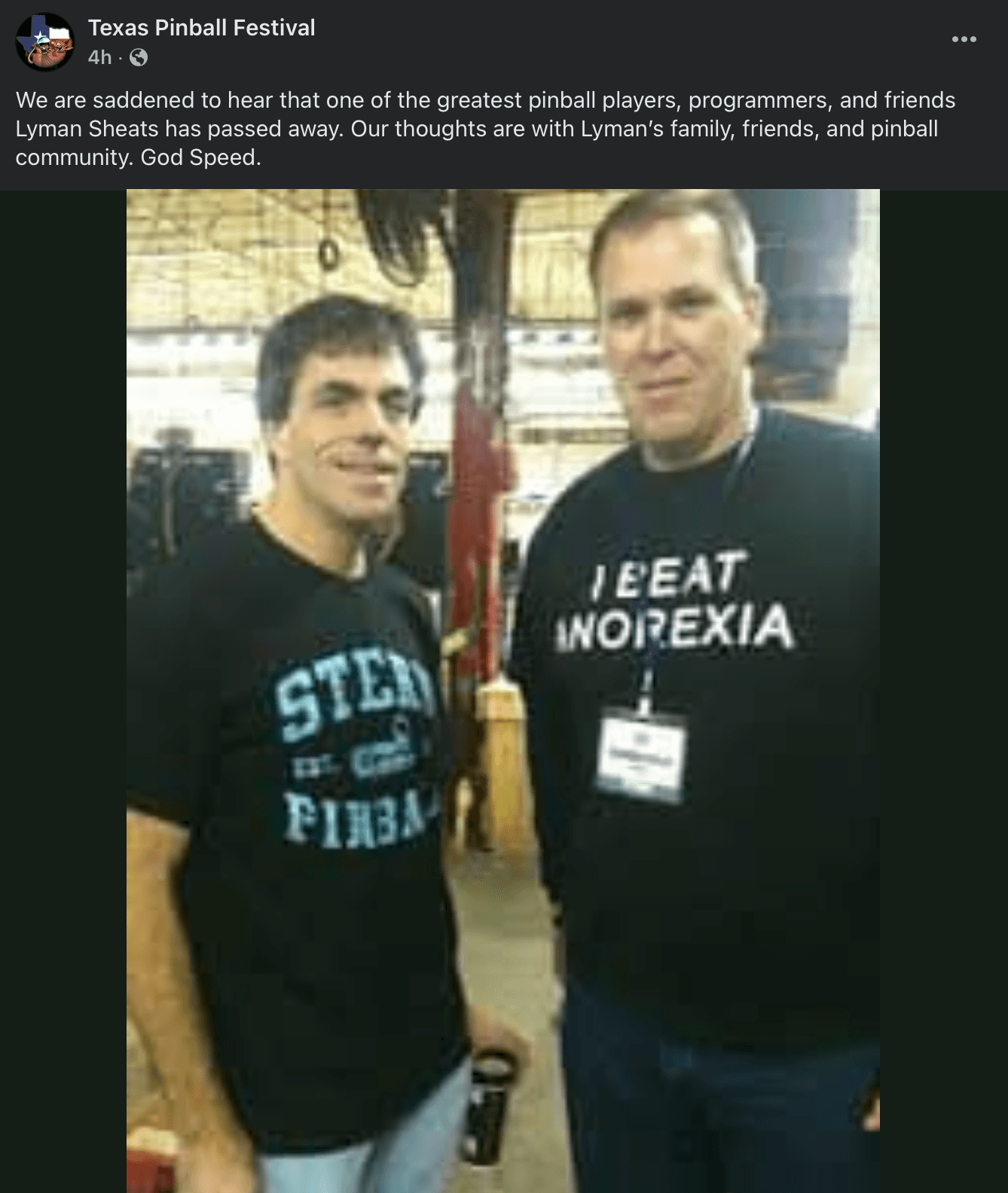 Two men in humorous t-shirts at a pinball event