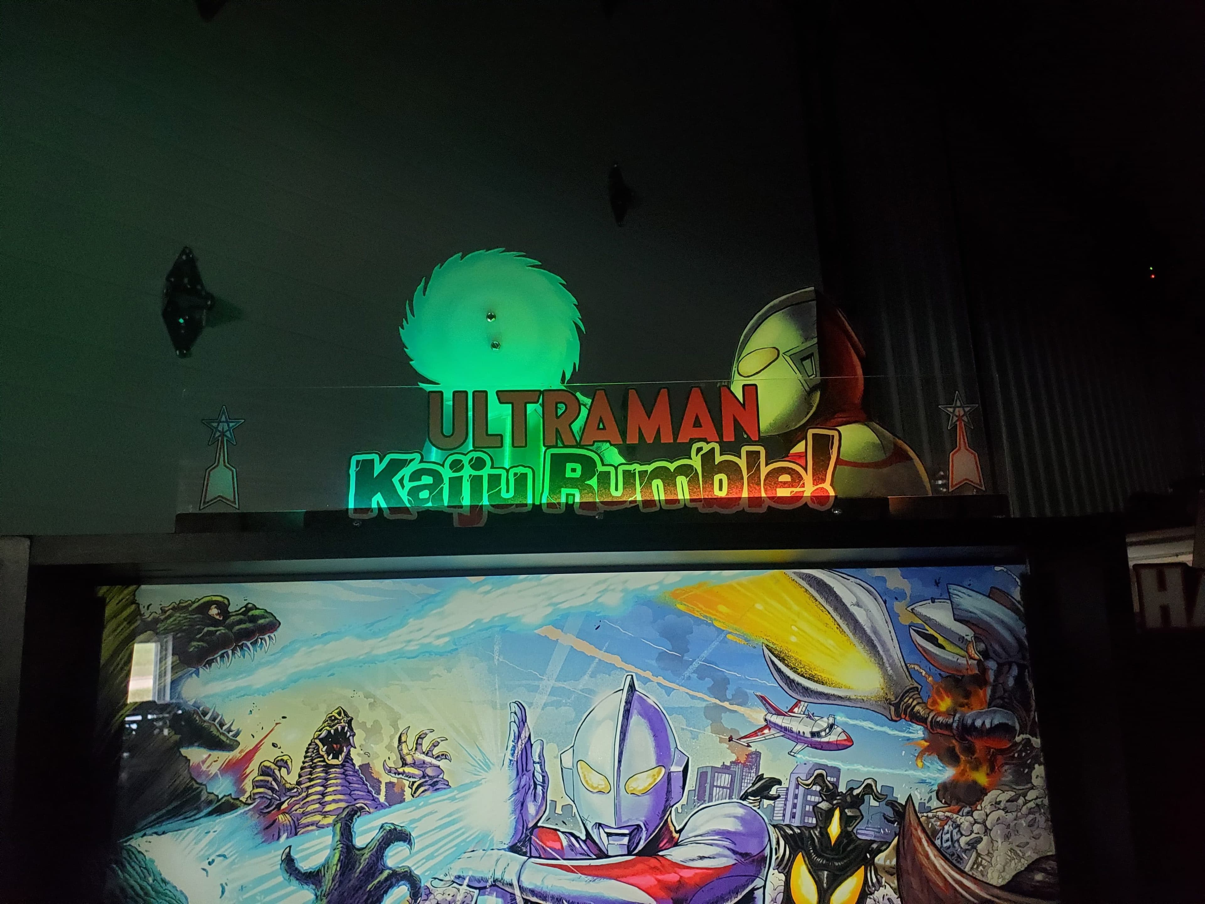 Ultraman Kaiju Rumble logo with colorful monster battle scene