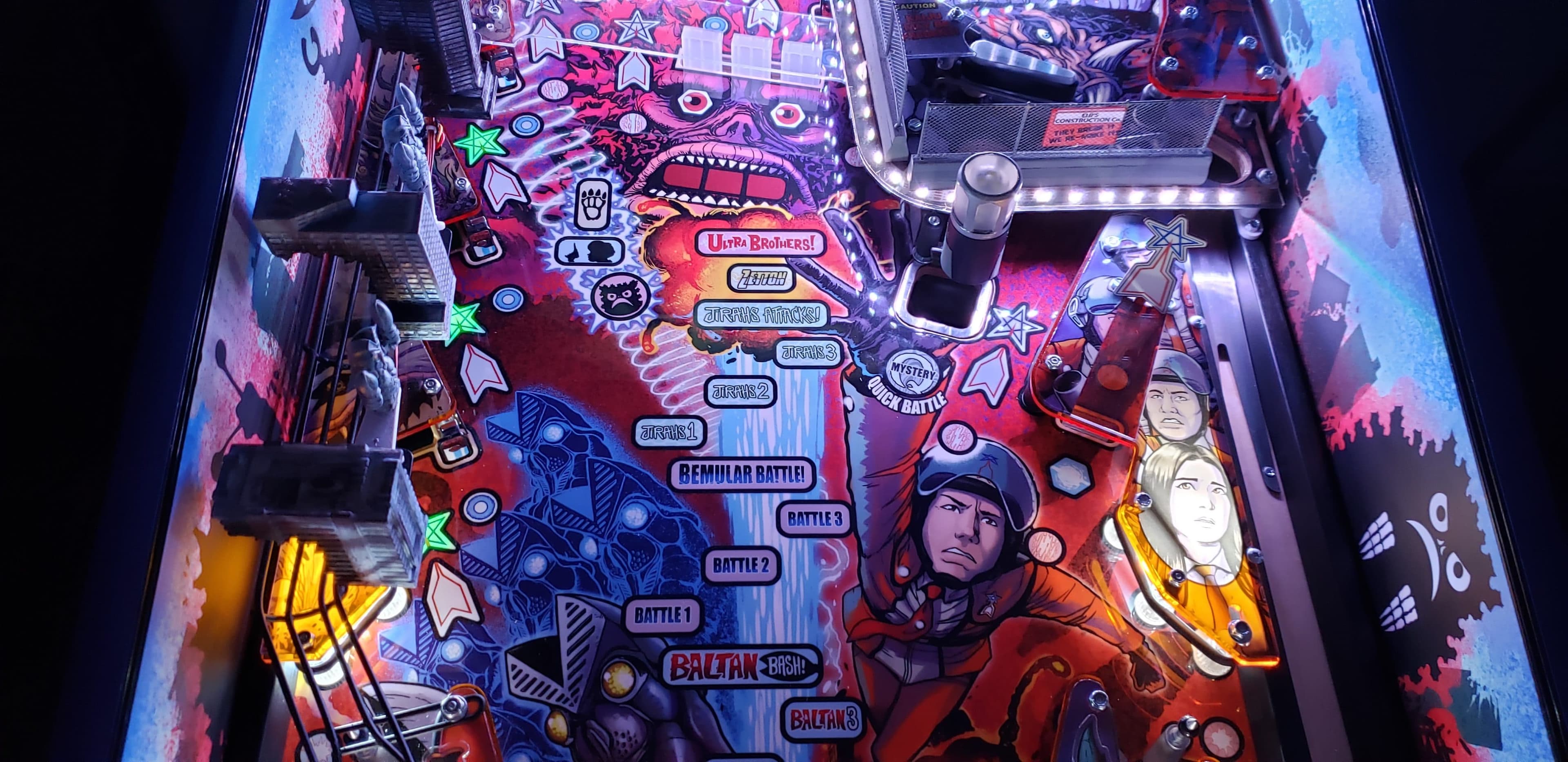Ultra Brothers pinball machine with colorful battles and sci-fi characters