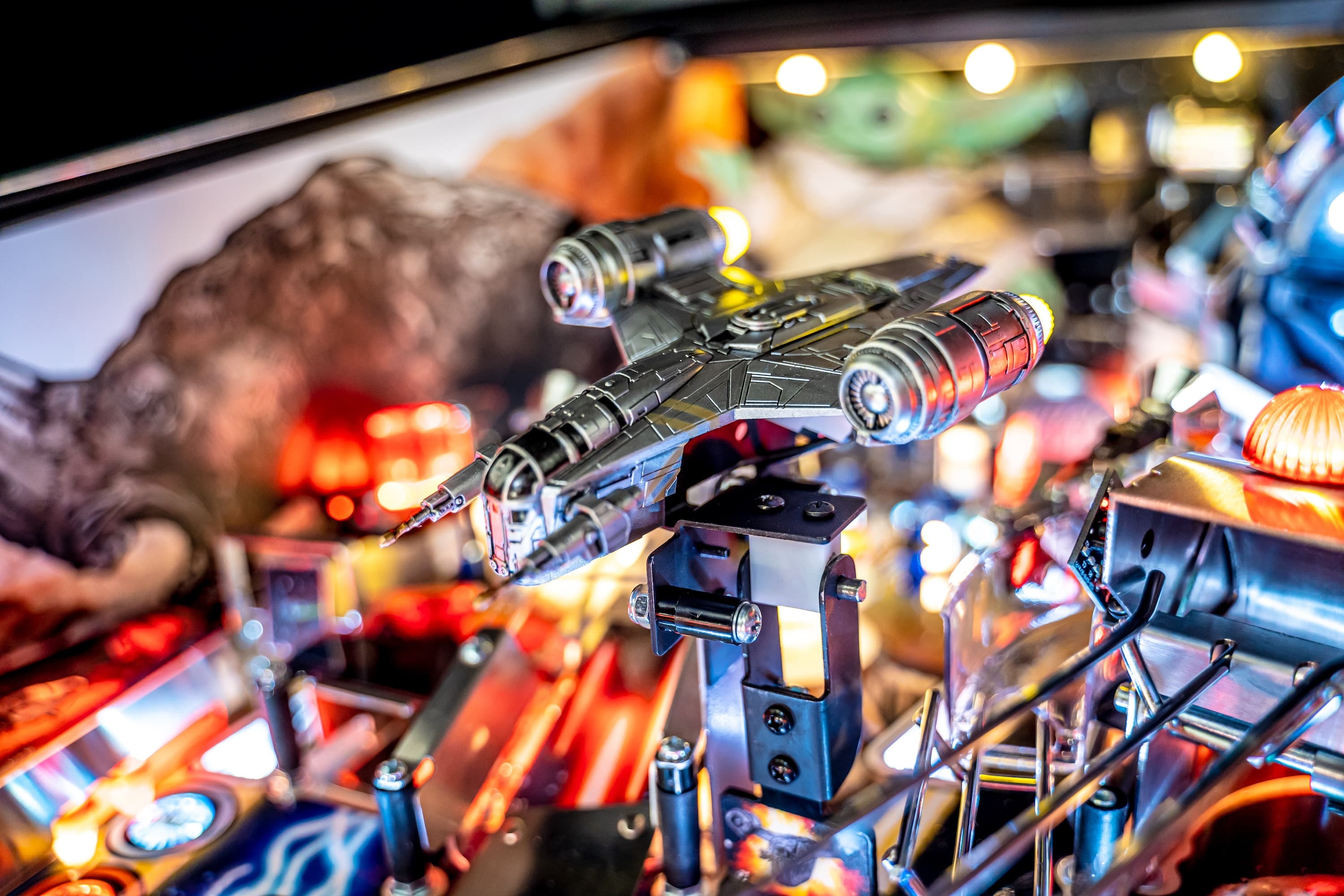 Detailed sci-fi spaceship model on complex mechanical background with colorful lights