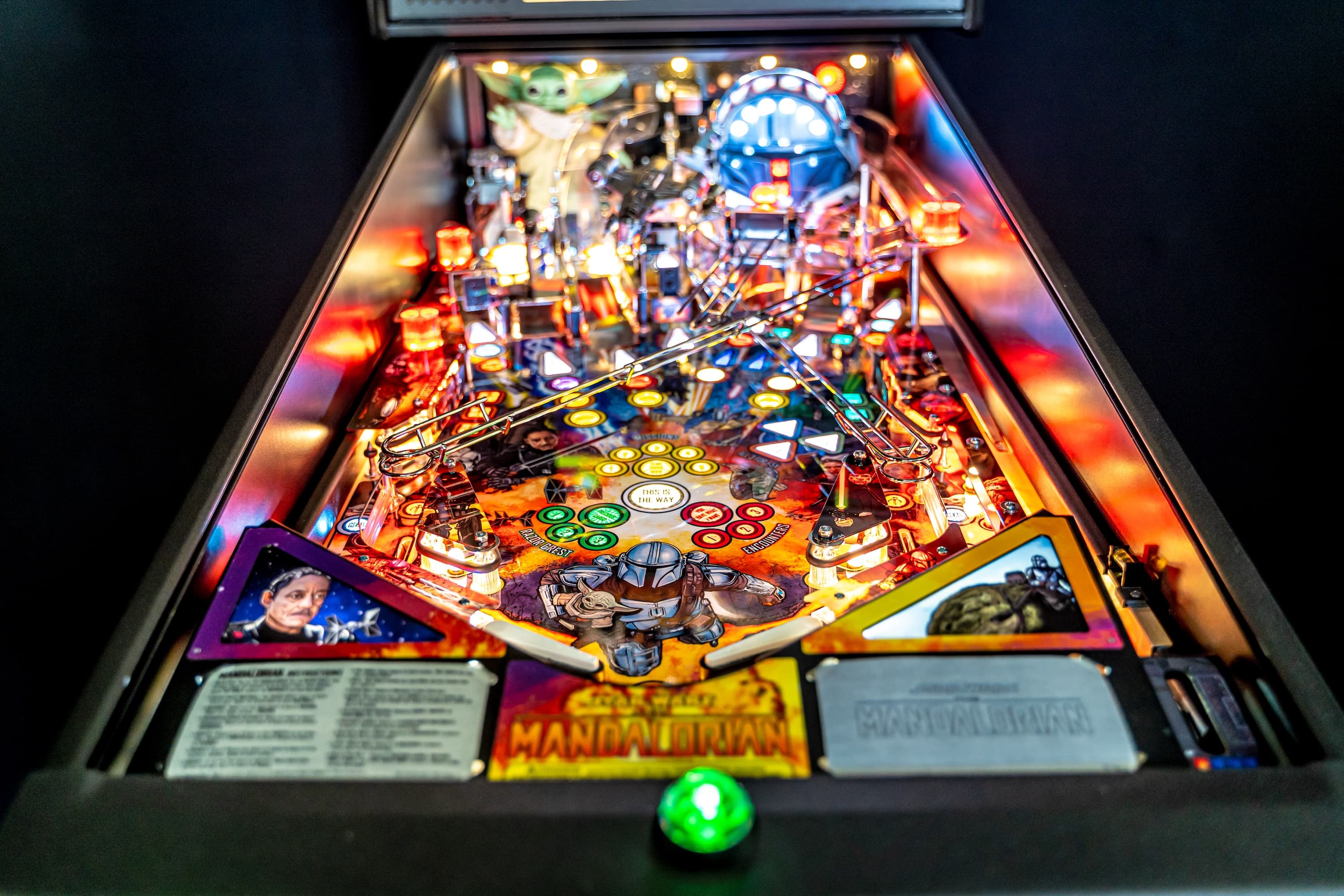The Mandalorian pinball machine with colorful lights and detailed playfield