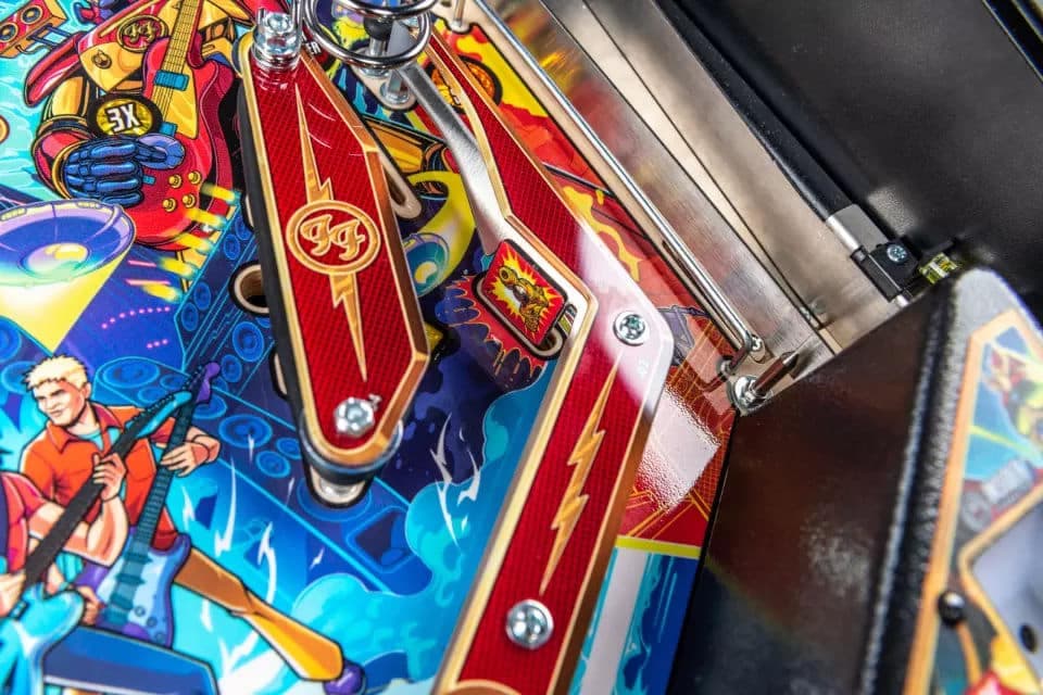 Colorful pinball machine with vibrant artwork and metallic mechanical components