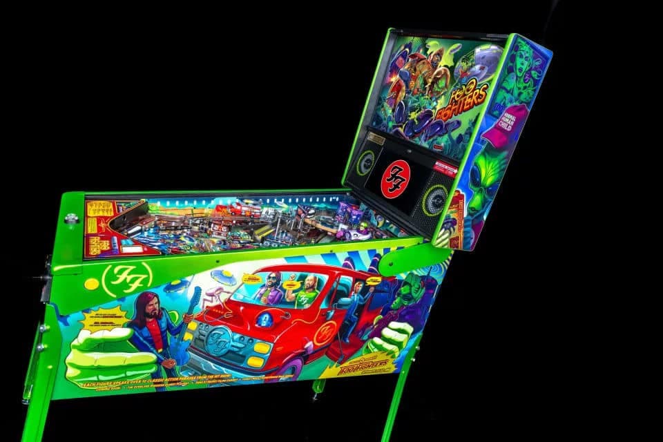 Colorful Foo Fighters themed pinball machine with bright green cabinet