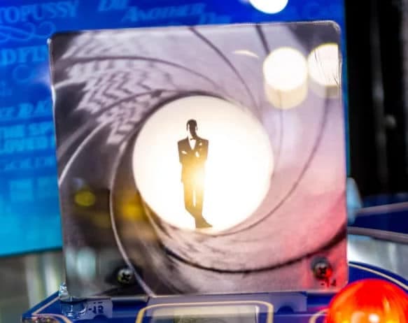 Silhouette of a figure in a gun barrel circle, iconic James Bond intro