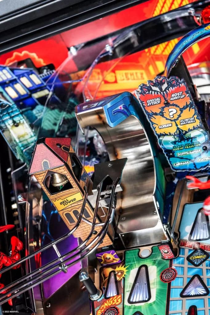 Colorful pinball machine with intricate game panels and vibrant design