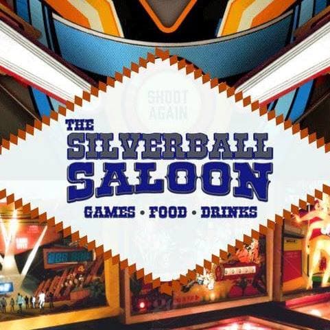 Colorful logo for Silverball Saloon featuring games, food, and drinks