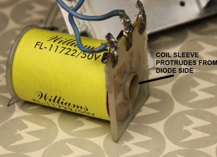 Yellow Williams capacitor with blue wire and metal coil sleeve
