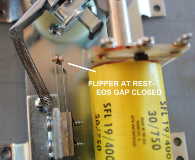 Yellow mechanical component with springs and metal parts, scientific equipment