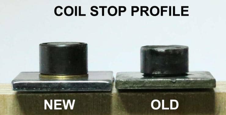 Comparison of new and old coil stop profiles showing wear and deformation